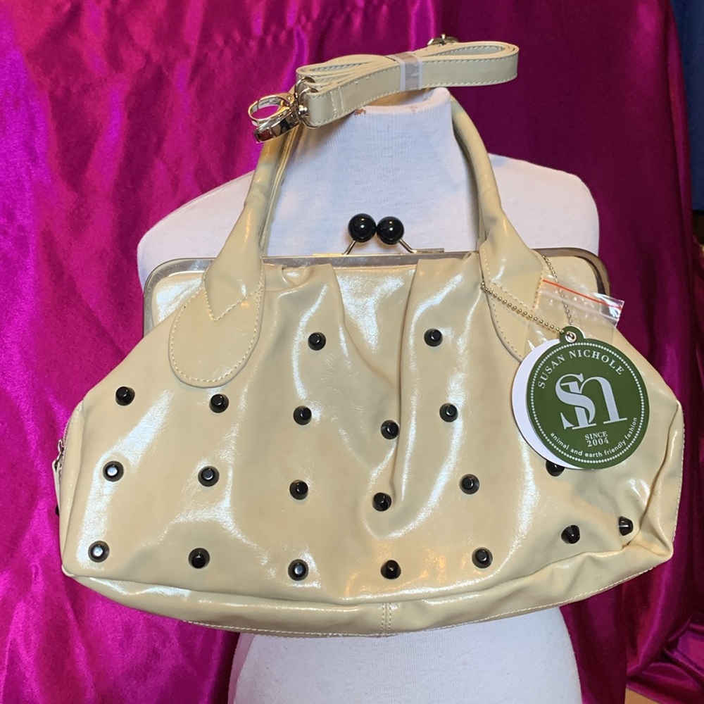 Very unique bag by Suzanne Nichole. Used two times with tag unzips aroun…